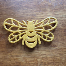 Load image into Gallery viewer, Cast Iron Yellow Bee Trivet
