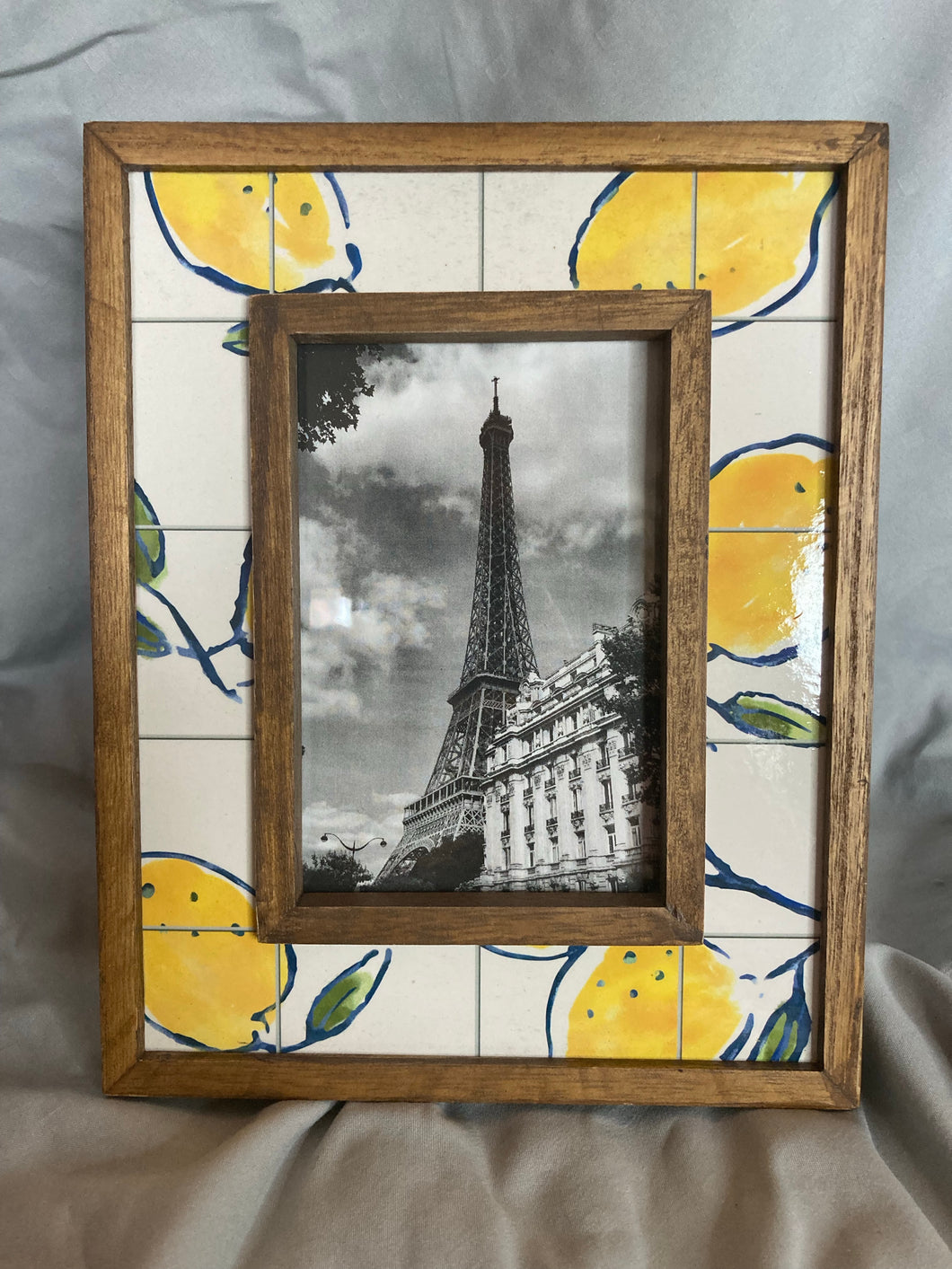 Wooden frame with lemons and Eiffel Tower print