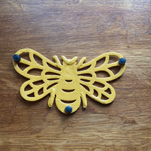 Load image into Gallery viewer, Cast Iron Yellow Bee Trivet
