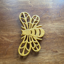 Load image into Gallery viewer, Cast Iron Yellow Bee Trivet
